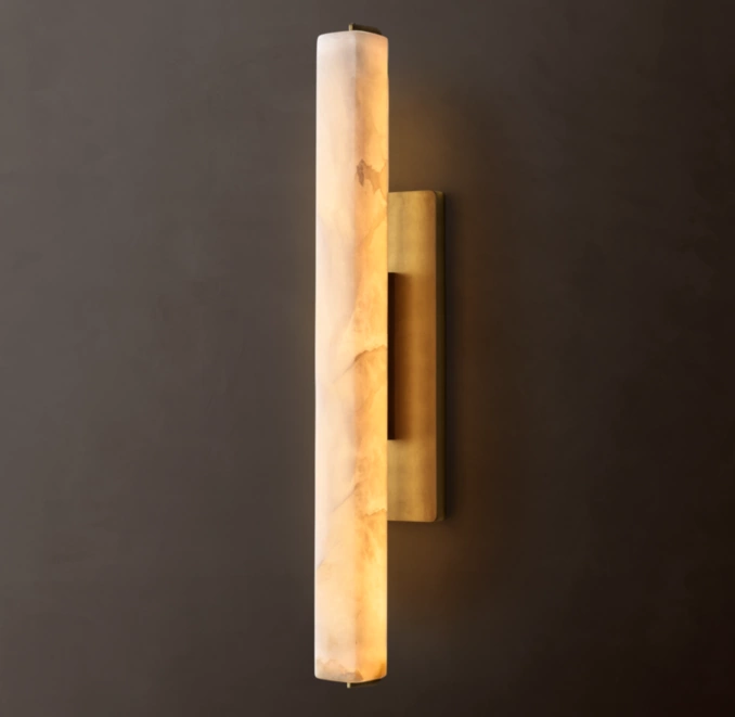 Gorvey Alabaster Sconce wall light with warm glow for elegant decor.