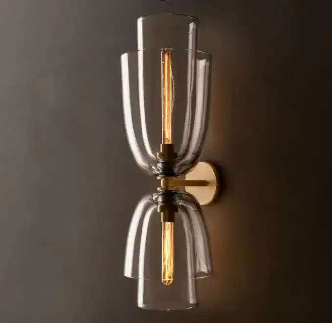 Modern glass and steel wall sconce with warm LED lighting for stylish interiors.