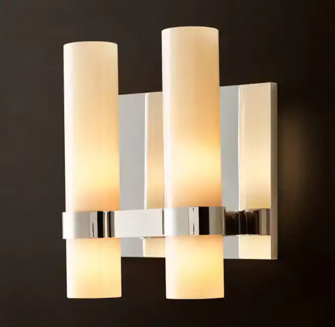 Elegant double wall light sconce with milk glass shades and chrome finish.
