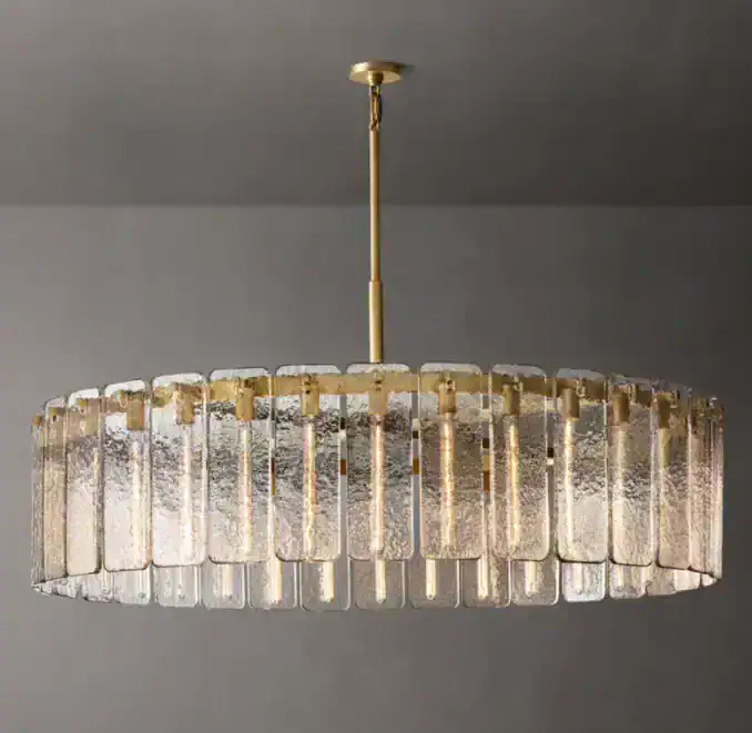 Elegant round glass chandelier with gold accents for modern interiors.