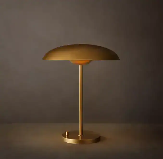 Elegant gold table lamp with acrylic diffuser for modern decor.