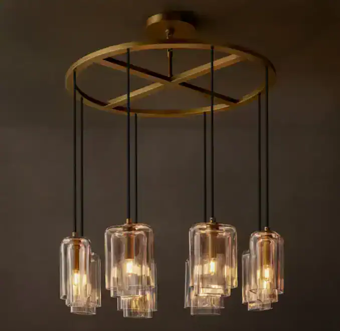 Modern chandelier with glass shades and gold accents for stylish lighting.