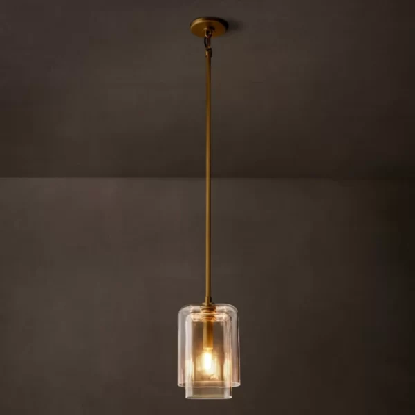 Modern pendant light with clear glass shade and gold fixture.