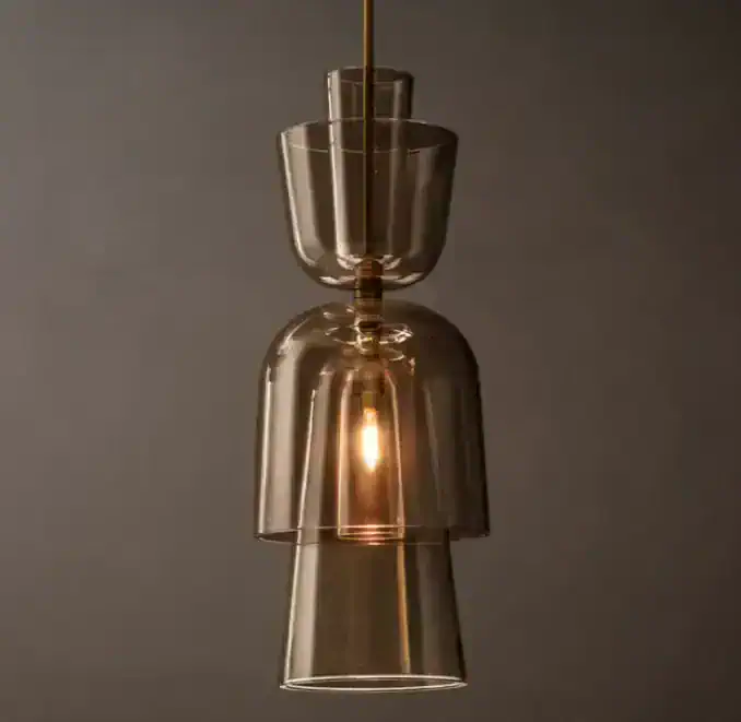Amber glass pendant light with modern design for stylish interiors.