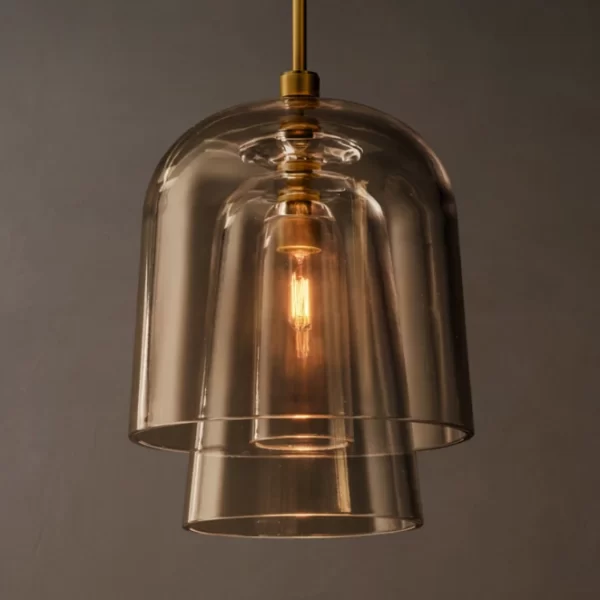 Modern glass pendant light with warm illumination and sleek design.
