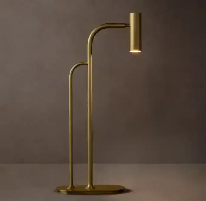 Elegant gold task lamp with adjustable arm for focused lighting.