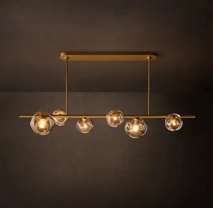 Modern bubble glass chandelier with gold finish for elegant lighting.