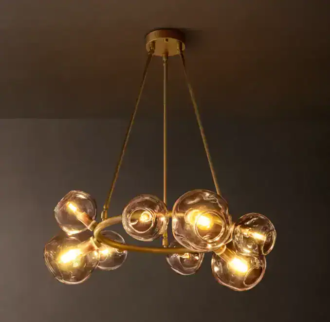 Modern glass orb chandelier with multiple glowing bulbs for elegant lighting.