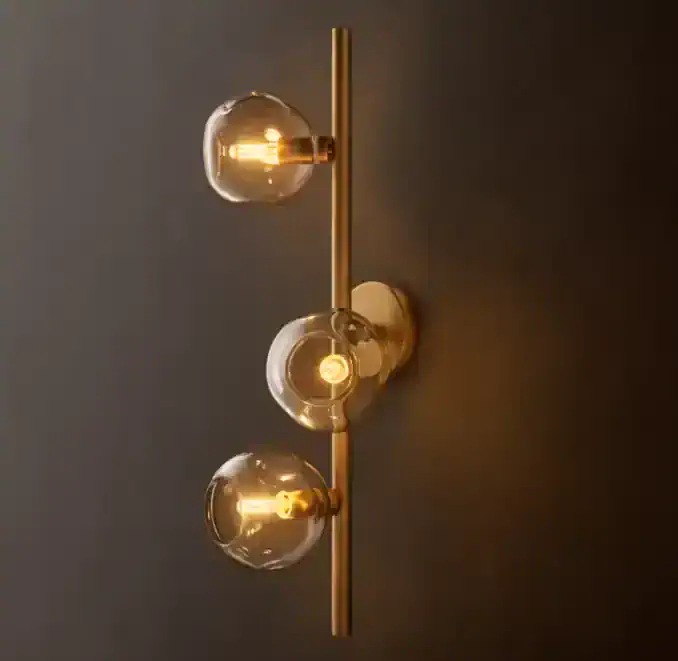 Modern bubble smoke glass wall sconce with warm lighting for interior decor.