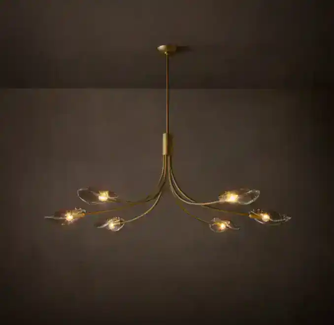 Modern chandelier with multiple glass shades and gold finish.