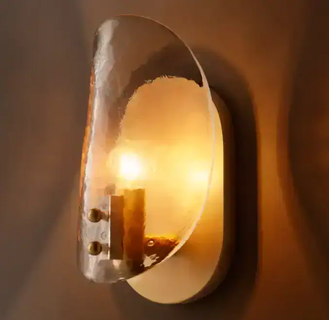 Gorvey Smoke Glass Sconce with warm lighting for modern decor.