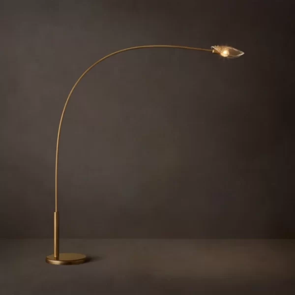 Modern floor lamp with curved brass stem and sleek LED light.
