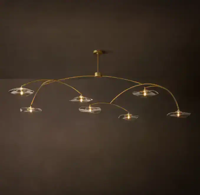 Modern gold chandelier with multiple glass shades for elegant lighting.