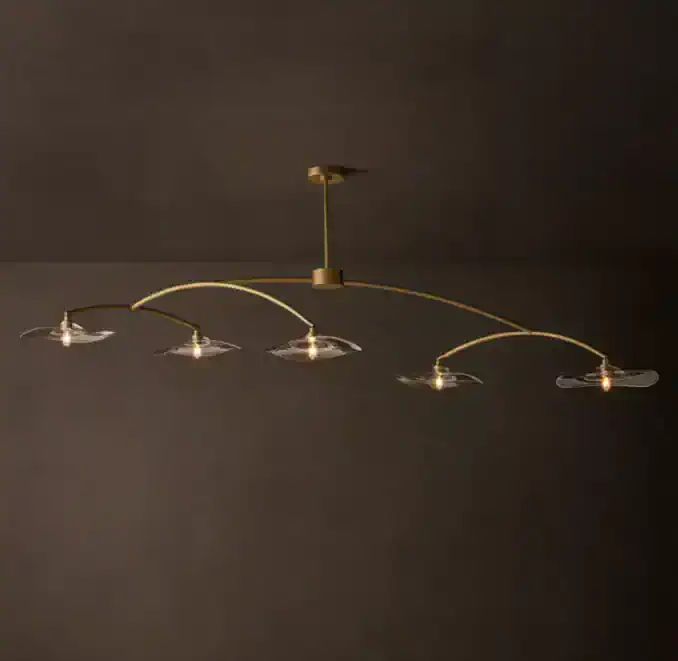 Elegant modern chandelier with glass shades and gold accents for stylish interiors.