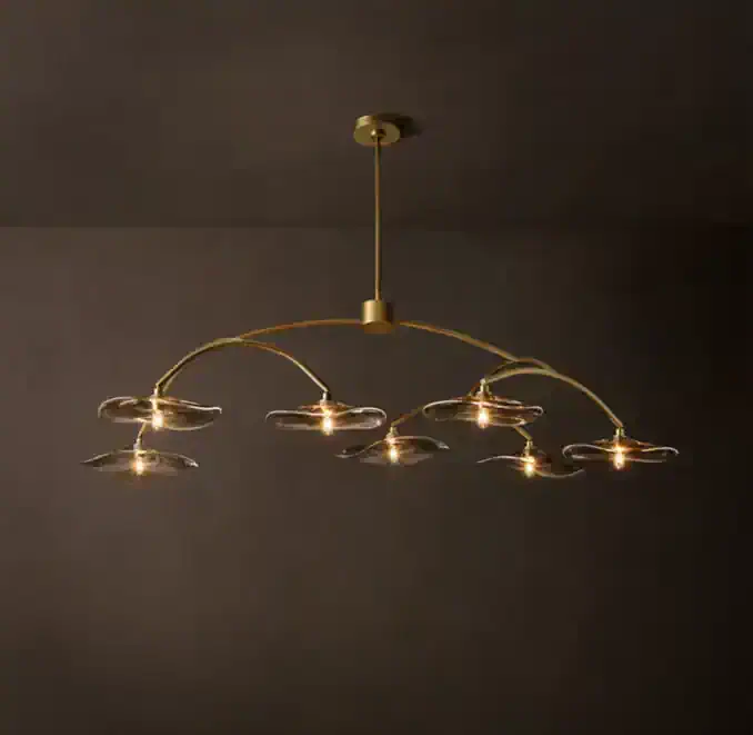 Elegant smoke glass chandelier with gold accents and multiple light fixtures.