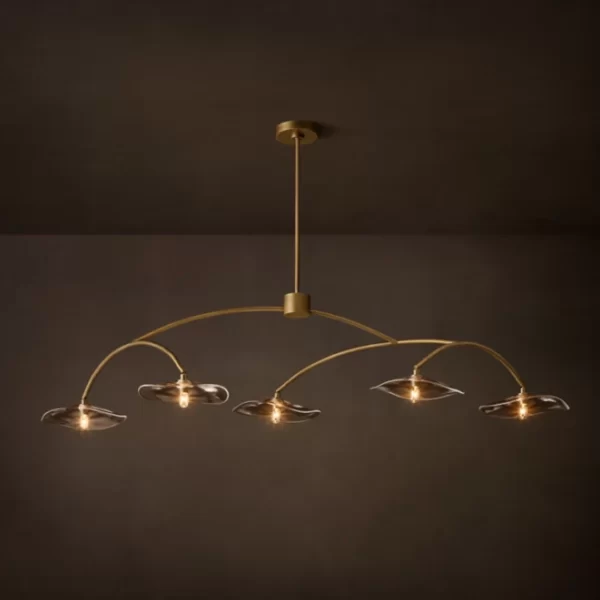 Modern linear chandelier with five glass shades and gold finish.