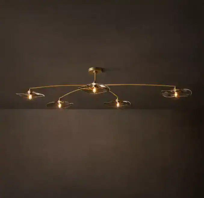 Modern smoke glass flushmount ceiling light with gold accents.