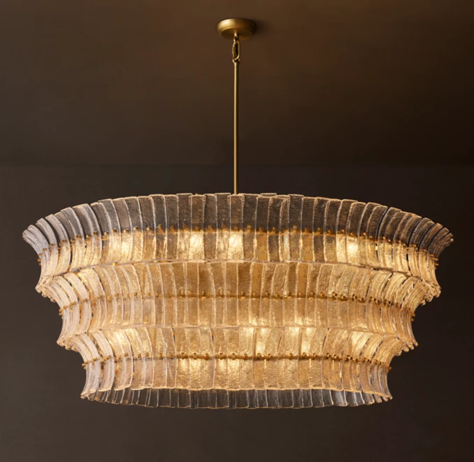 Elegant glass chandelier with layered design for modern interiors.