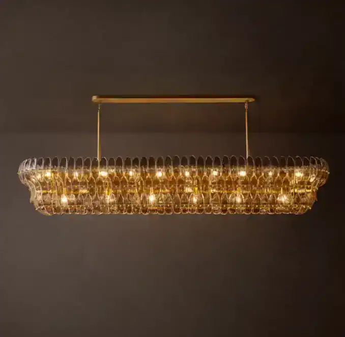 Elegant glass chandelier with warm lighting for modern interiors.
