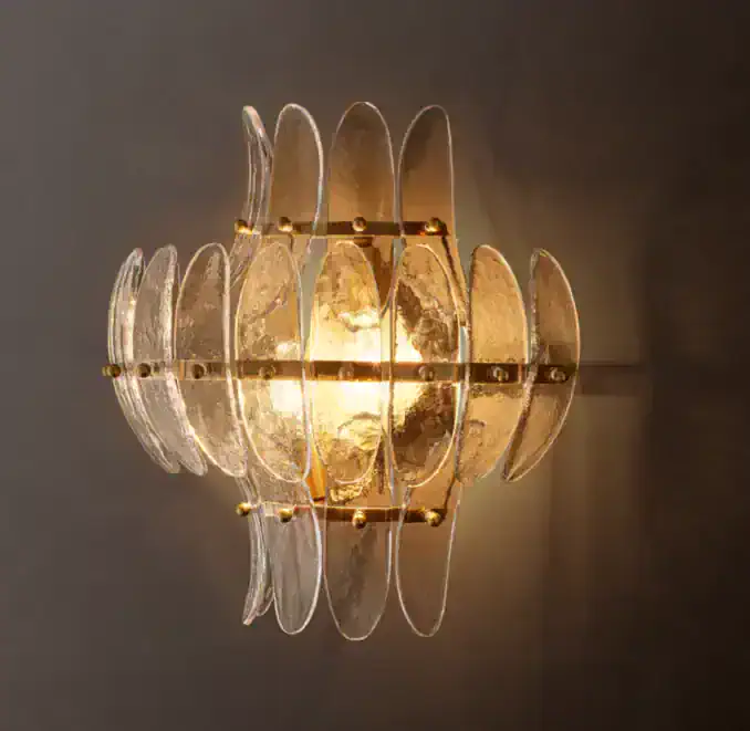 Elegant glass petal sconce with warm lighting for modern decor.