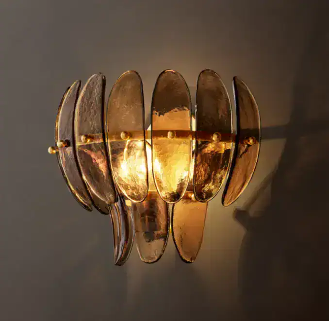 Gorvey Smoke Glass Sconce Wall Light with warm illumination.
