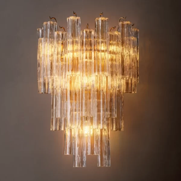 Elegant modern glass sconce with warm lighting for sophisticated interiors.