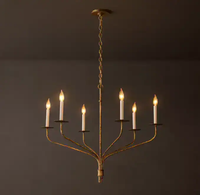 Elegant gold chandelier with eight candle-style lights for stylish lighting.