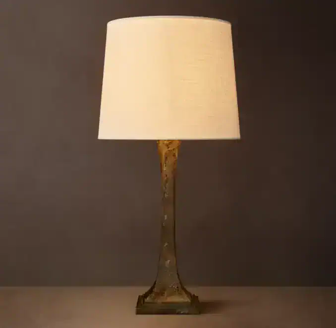 Elegant brass table lamp with linen shade for classic home decor.