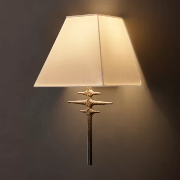 Modern metal sconce with linen shade from Gorvey Lighting.