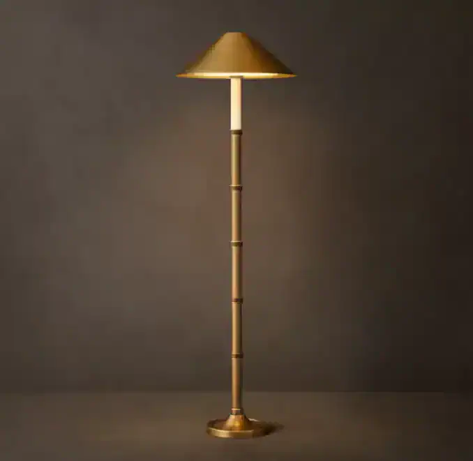 Elegant bamboo steel floor lamp with gold finish for modern decor.