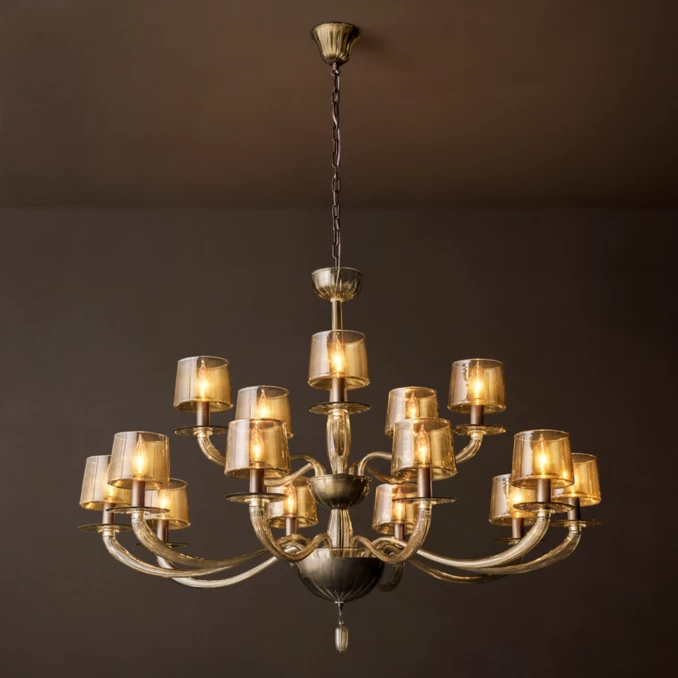 Elegant round chandelier with amber glass tiers and multiple light fixtures.