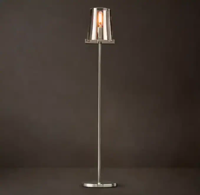 Modern Gorvey lighting floor lamp with glass shade and brass accents.