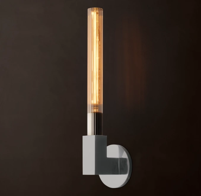 Modern ribbed glass wall sconce in solid brass for stylish lighting.