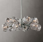 Elegant modern crystal chandelier with multiple glass shades and LED lights.
