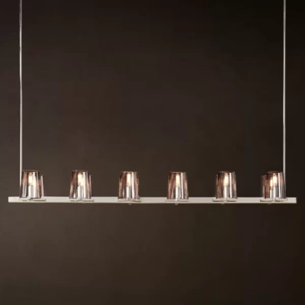 Modern linear brass light fixture with six glass shades for elegant lighting.