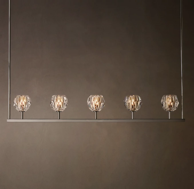 Elegant crystal glass linear chandelier with six spherical pendants.