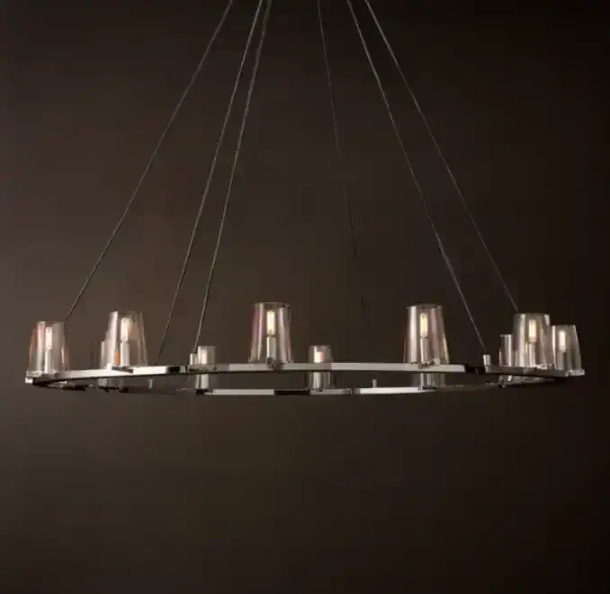 Modern circular chandelier with glass shades for elegant lighting.