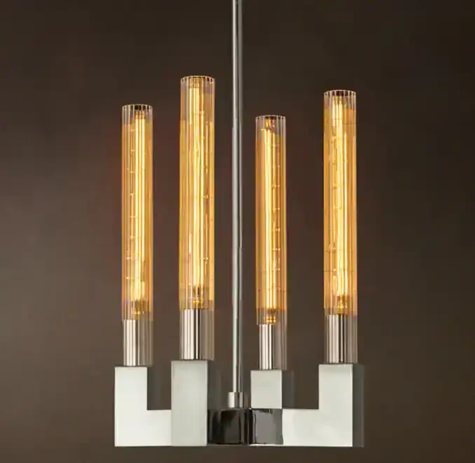 Modern pendant light fixture with brass and glass elements for stylish interiors.