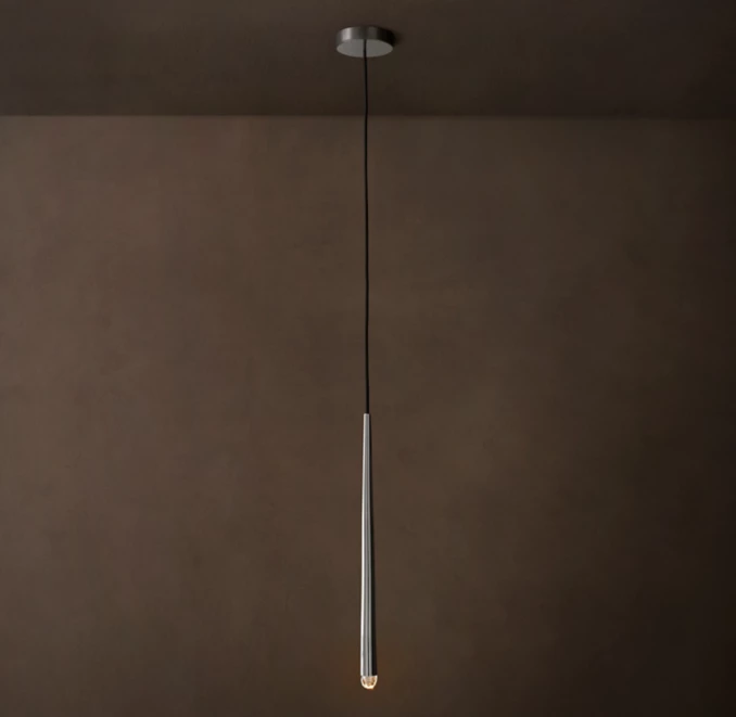 Modern pendant light hanging from ceiling with a sleek design.