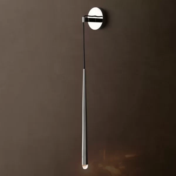 Modern brass wall sconce with pull chain for ambient lighting.
