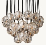 Elegant crystal brass cluster chandelier with multiple hanging lights.