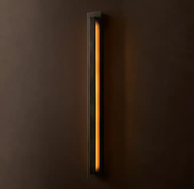 Modern black wall sconce with warm LED lighting for contemporary decor.