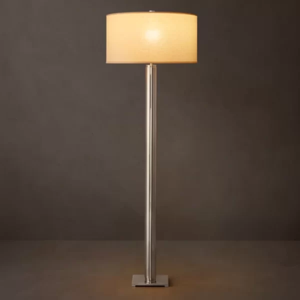 Modern floor lamp with a beige lampshade and sleek metal stand.