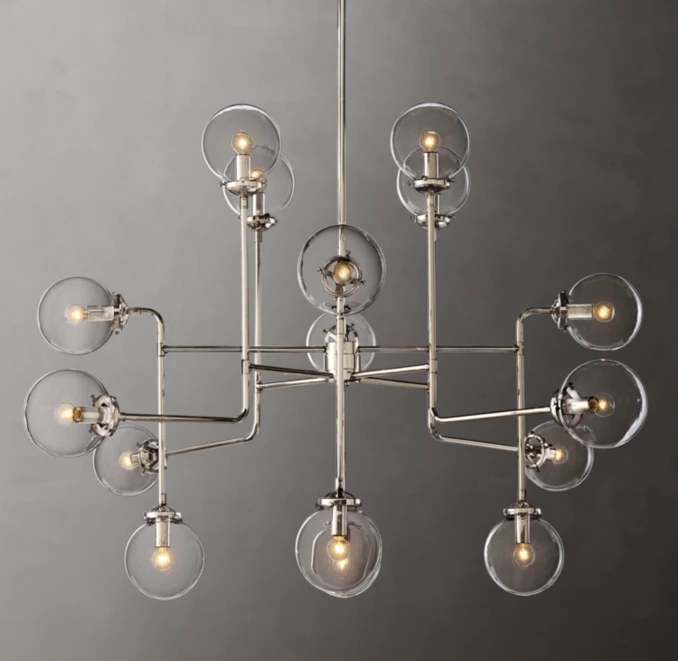 Contemporary chandelier with multiple exposed bulbs and glass globes.