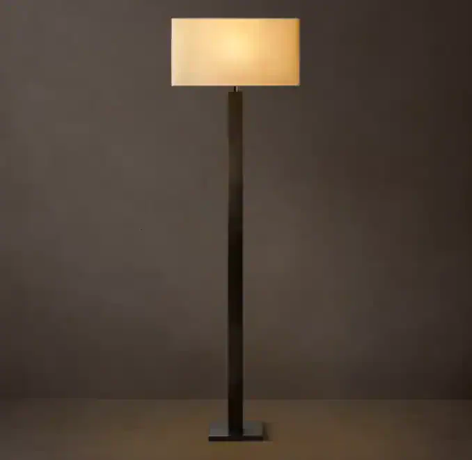 Modern floor lamp with square column base and beige lampshade.