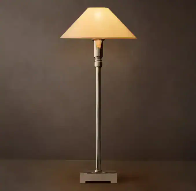 Modern metal floor lamp with pyramid-shaped lampshade and adjustable telescoping stand.