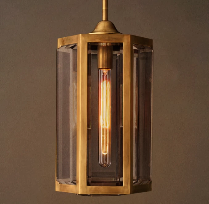 Elegant pendant light with glass and brass design for modern interiors.