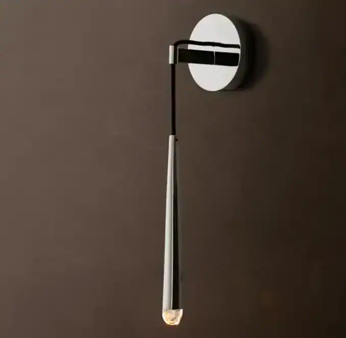 Modern brass wall sconce with LED light for stylish lighting.